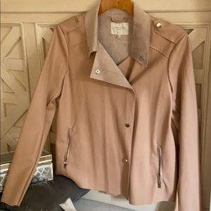 Beautiful light pink leather jacket .